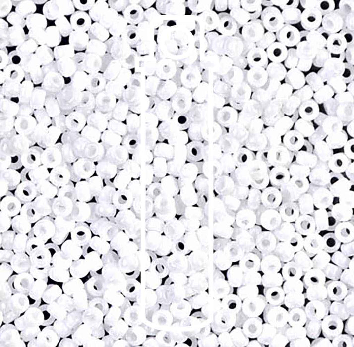 Close-up of opaque white Miyuki seed beads #402, size 11/0, with a glossy surface and small center holes