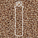 Duracoat galvanized champagne Miyuki seed beads, close-up of shiny gold beads with a white tube outline