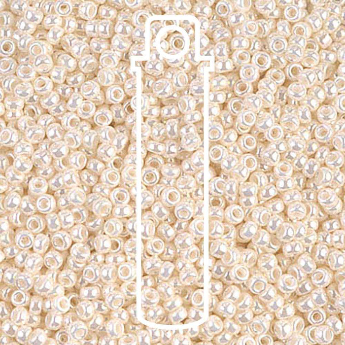 Antique ivory pearl Ceylon Miyuki 11/0 seed beads up close, with a tube outline showing the 23.5g vial size