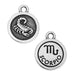 Round pewter zodiac charm in a closer crop, with a scorpion design on one side and the Scorpio glyph on the other