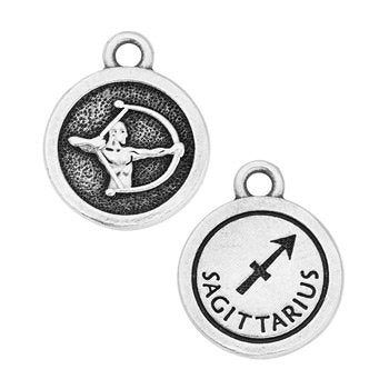 Front and back of round pewter Sagittarius charm with archer relief, arrow glyph and loop at top, closer crop