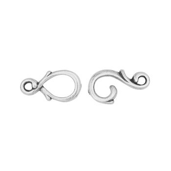 Closer, tighter crop of pewter hook and eye clasp halves showing the curled vine detail and small loops for attaching