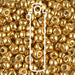 Duracoat galvanized gold Miyuki 6/0 seed beads close-up with a white tube outline overlay