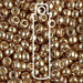 Close-up of Duracoat galvanized champagne Miyuki 6/0 seed beads with a tube outline overlay