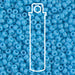 Opaque turquoise blue Miyuki 8/0 seed beads up close, with a tube outline showing the 22g tube packaging