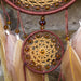 Dream catcher with amber beads and feathers, a craft idea made with waxed cord