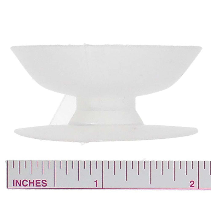 Thread bobbin above an inch ruler for size reference, measuring a little under 2 inches across