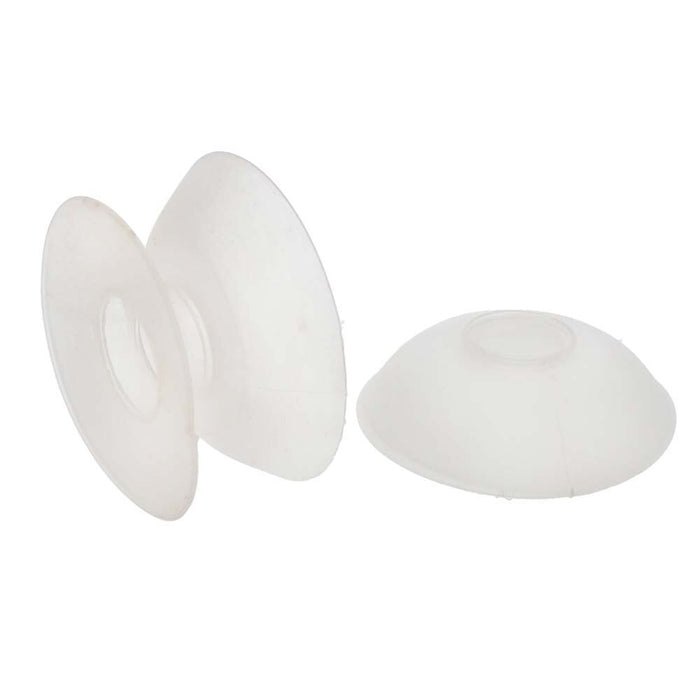 Two clear thread bobbins, one standing on its edge showing the flat flange and one resting on its side