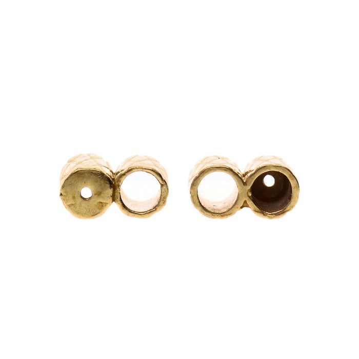 End view of two brass slide clasps showing the open holes and the small hole in the closed end