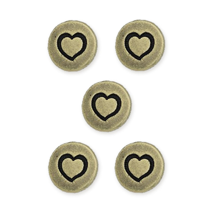 Antiqued brass small heart buttons, five round pewter buttons with a black heart design arranged on white