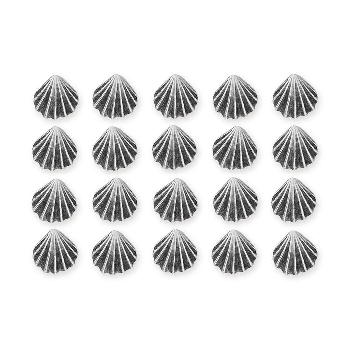 Antiqued silver scallop shell buttons arranged in four rows of five on a white background
