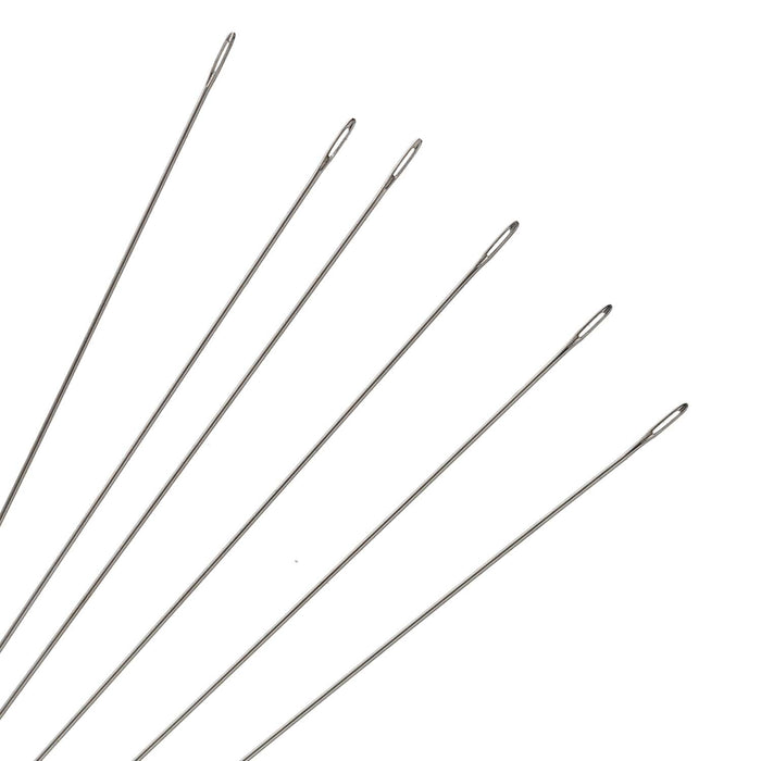 Close-up of six size 10 beading needles fanned out showing the slim eyes and points