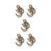 Antiqued brass open Om charms arranged in a group of five on a white background