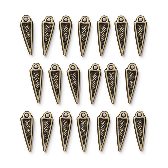 Antiqued brass woven spike charms, 20 pieces arranged in three rows on white