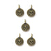 Antiqued brass skull charms, five round pewter charms with loops arranged on white