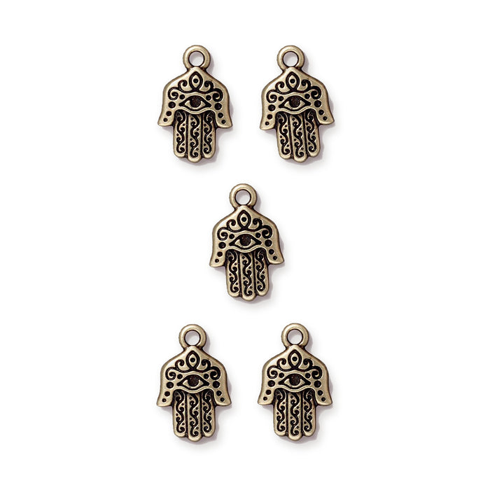 Antiqued brass hamsa hand charms with eye and scroll detail, five charms arranged in an X pattern