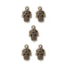 Antiqued brass hamsa hand charms with eye and scroll detail, five charms arranged in an X pattern