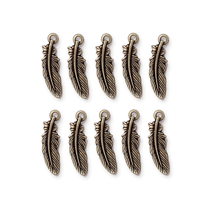 Antiqued brass feather charms arranged in two rows of five, showing the engraved feather detail and top loop
