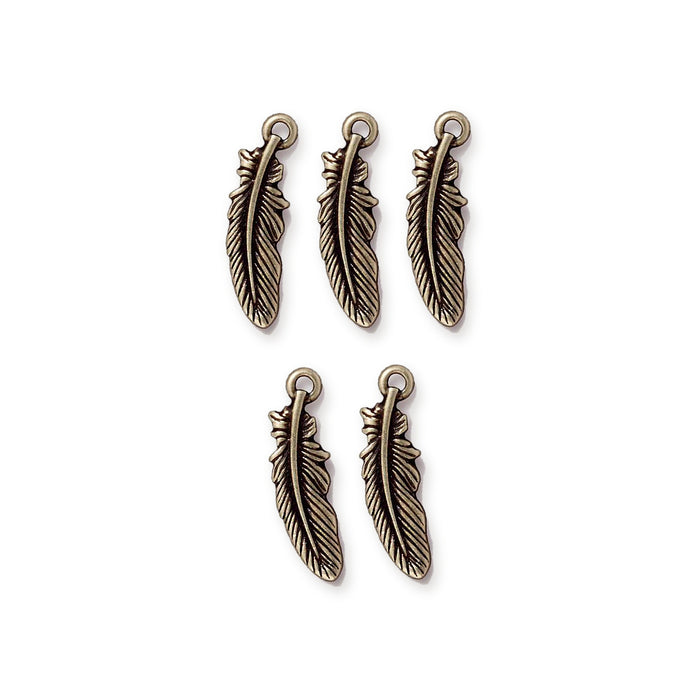 Five antiqued brass feather charms arranged in two rows, three on top and two below