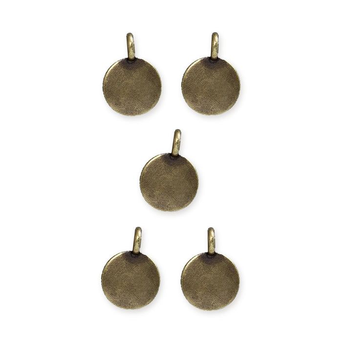 Antiqued brass blank round charms, five pewter charms with loops arranged in a group