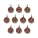 Antiqued copper skull charms, ten round pewter pieces with loops arranged in rows