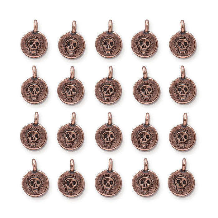 Antiqued copper skull charms arranged in a grid of four rows with five round pewter charms each