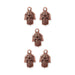 Antiqued copper hamsa hand charms with eye and scroll detail, five charms arranged in a group