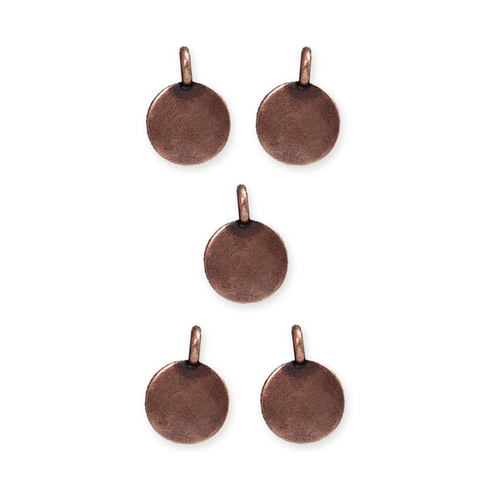 Antiqued copper blank round charms with loops, five pewter charms arranged in a pattern