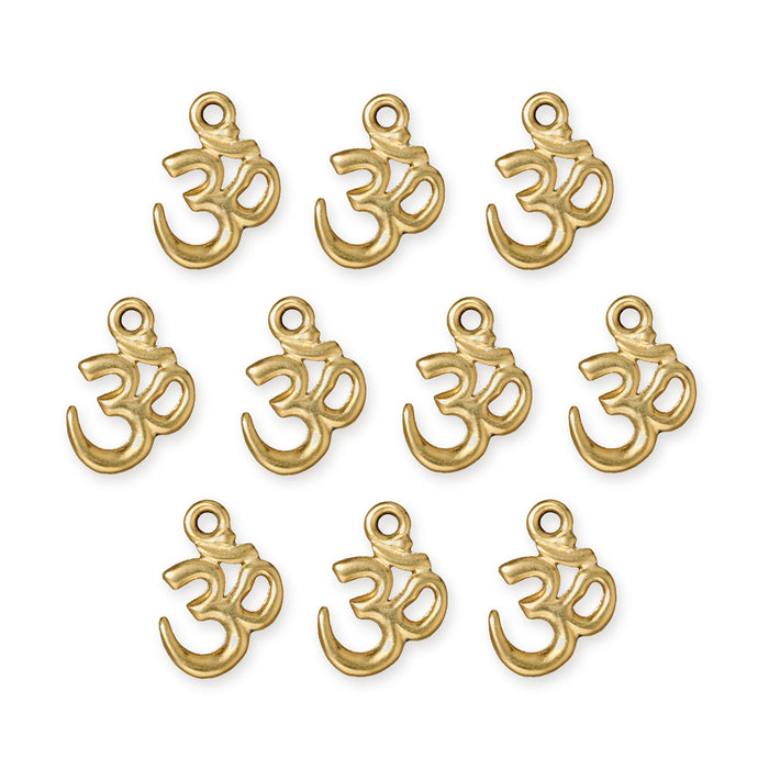 Gold plated open Om charms, ten pieces arranged in rows on a white background