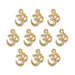 Gold plated open Om charms, ten pieces arranged in rows on a white background