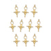 Ten gold plated Tuareg cross motif pendants arranged in rows on a white background