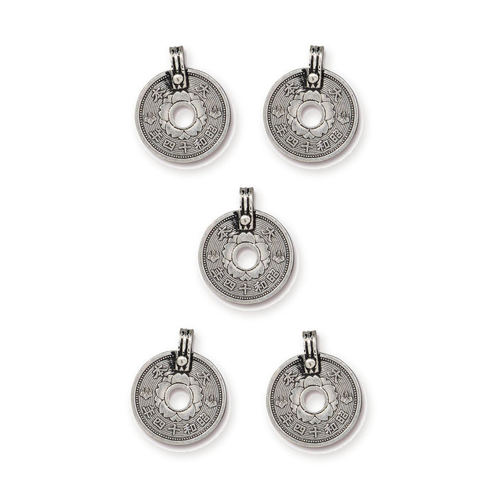 Five antiqued silver Asian coin charms with center holes and loops arranged on a white background