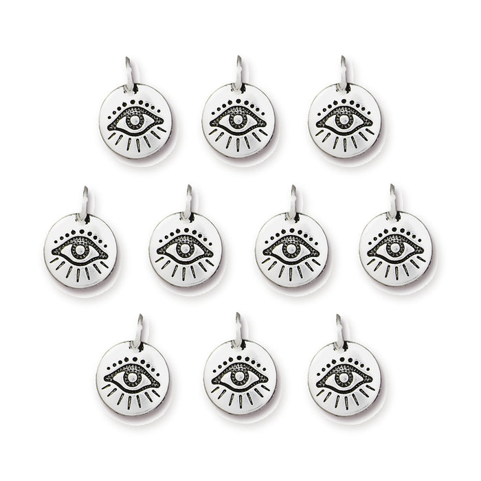 Antiqued silver evil eye charms, ten round pewter charms with jump rings laid out in rows