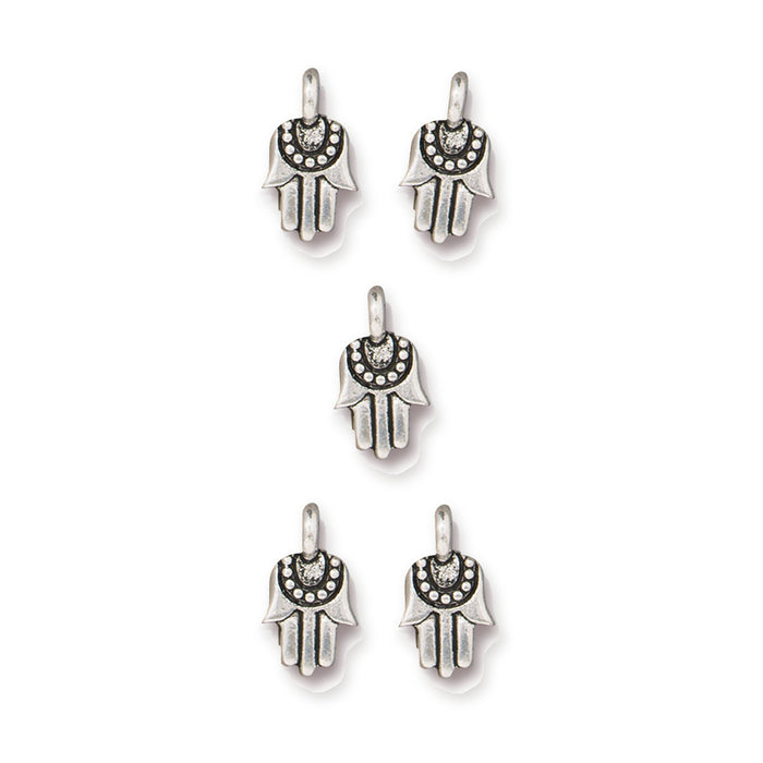 Antiqued silver miniature hamsa charms, five pewter charms arranged on white