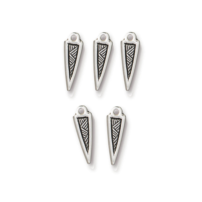 Antiqued silver woven spike charms, five pewter charms arranged in two rows on white