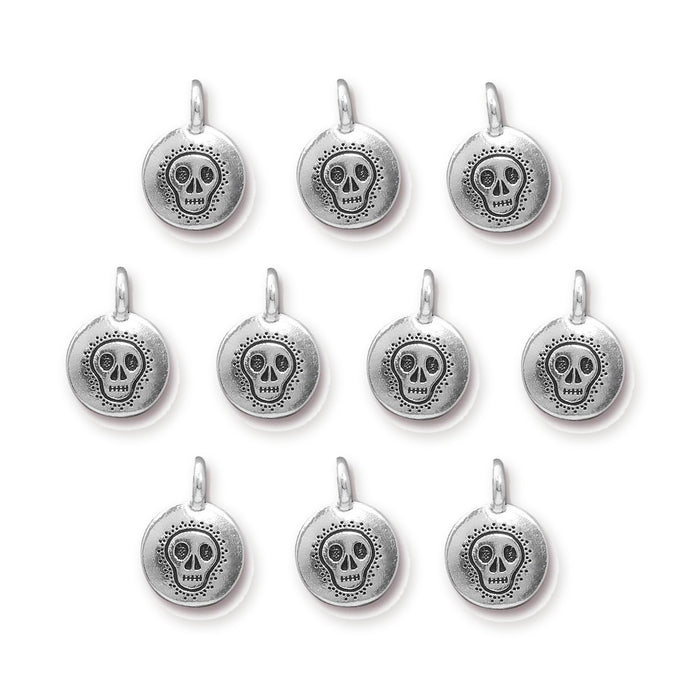 Antiqued silver skull charms, ten round pewter charms with loops arranged in rows