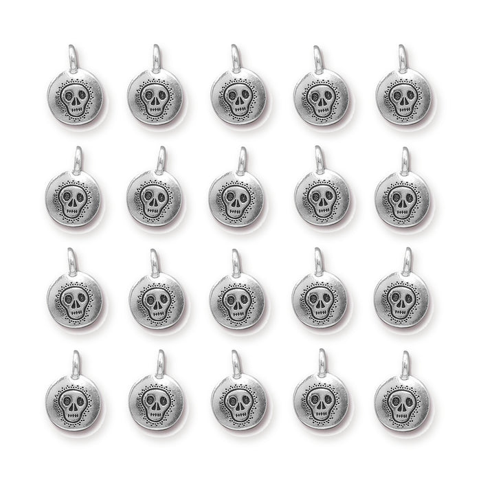 Antiqued silver skull charms arranged in a grid of four rows with five round pewter charms each