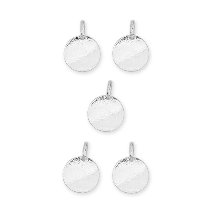 Shiny silver blank round pewter charms, five pieces arranged in a group on a white background