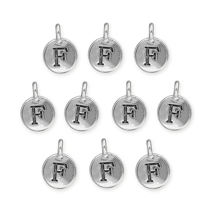 Antiqued silver letter F charms, ten round pewter charms with loops laid out in rows
