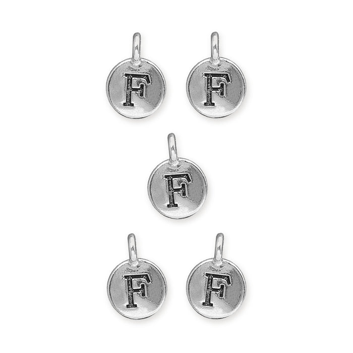 Antiqued silver letter F charms, five round pewter charms with loops arranged in a group on white