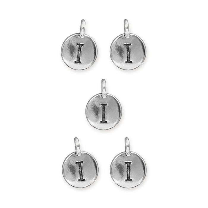 Antiqued silver letter I charms, five round pewter discs with loops laid out on white