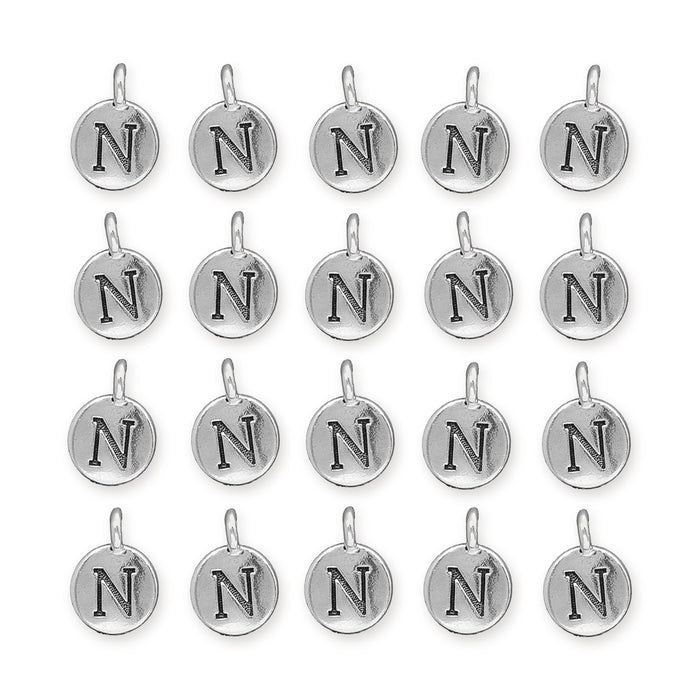 Antiqued silver letter N charms arranged in a grid of four rows with five round pewter charms each