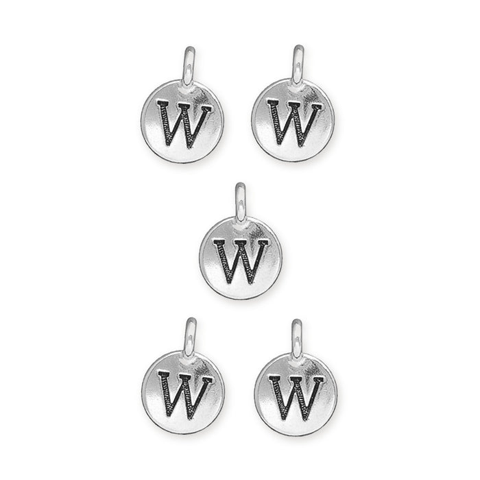 Antiqued silver letter W charms, five round pewter charms with loops arranged on a white background