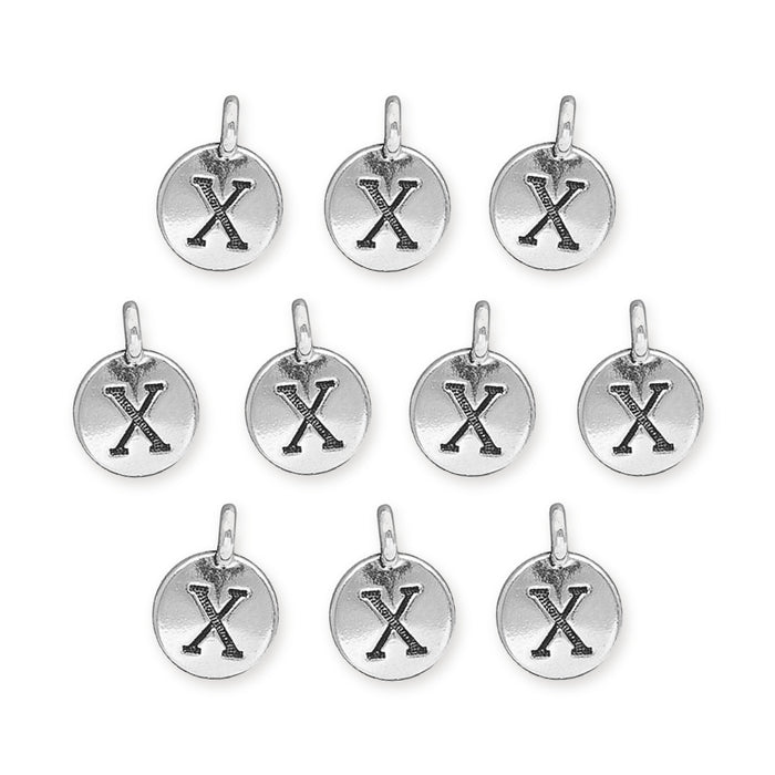 Antiqued silver letter X charms, ten round pewter charms laid out in rows