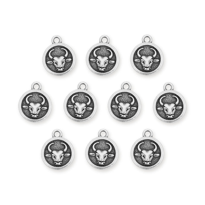 Antiqued silver Taurus zodiac charms with bull face design, ten pewter charms arranged in rows