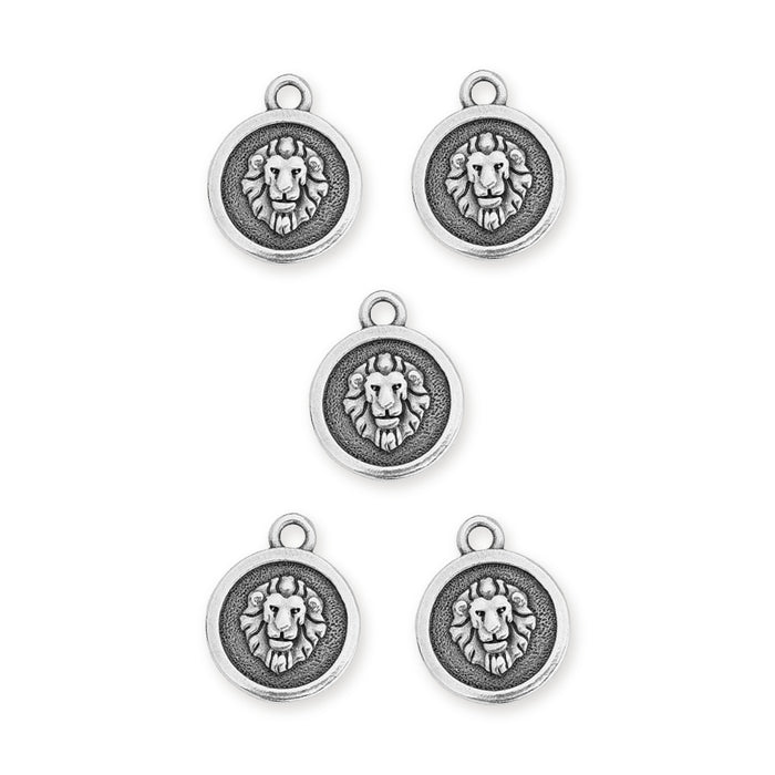 Antiqued silver Leo zodiac charms, five round pewter charms each showing a lion head, laid out on white