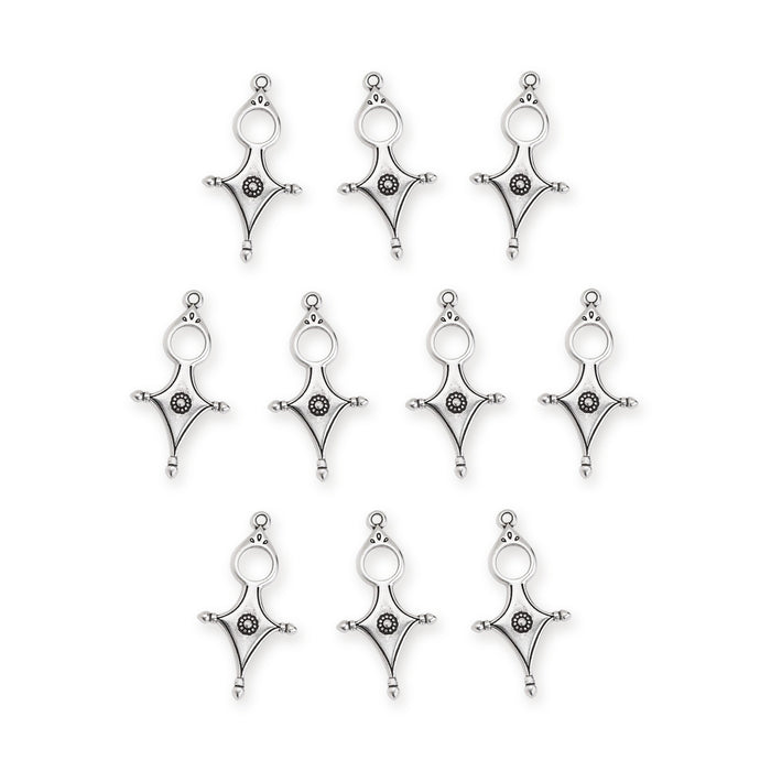 Antiqued silver Tuareg cross pendants, ten pieces laid out in rows showing the open ring top and diamond shape