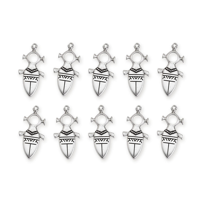 Antiqued silver Tuareg motif pendants, ten charms arranged in two rows on white