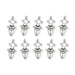 Antiqued silver Tuareg motif pendants, ten charms arranged in two rows on white