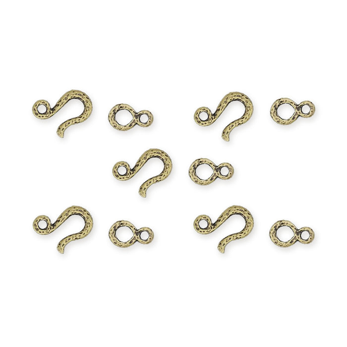 Antiqued brass hammered hook and eye clasp sets, five hooks and five eyes laid out on white